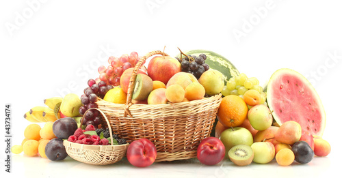 Assortment of exotic fruits and berries in baskets isolated