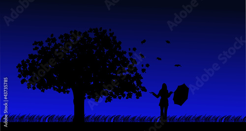 Autumn tree in the wind and girl with umbrella silhouette © tinica10