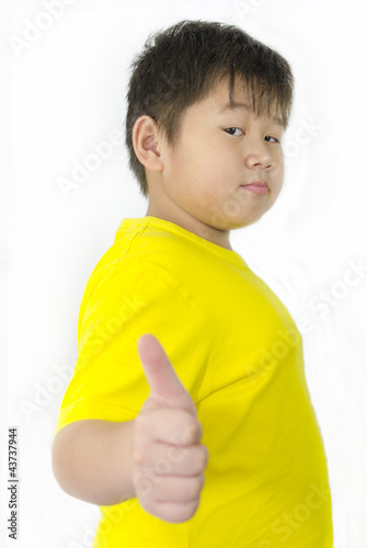 boy with thumbs up over white background