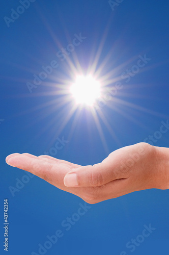 Hand and sun