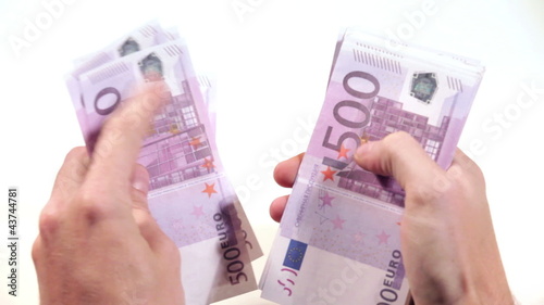 Men hand counts the euro