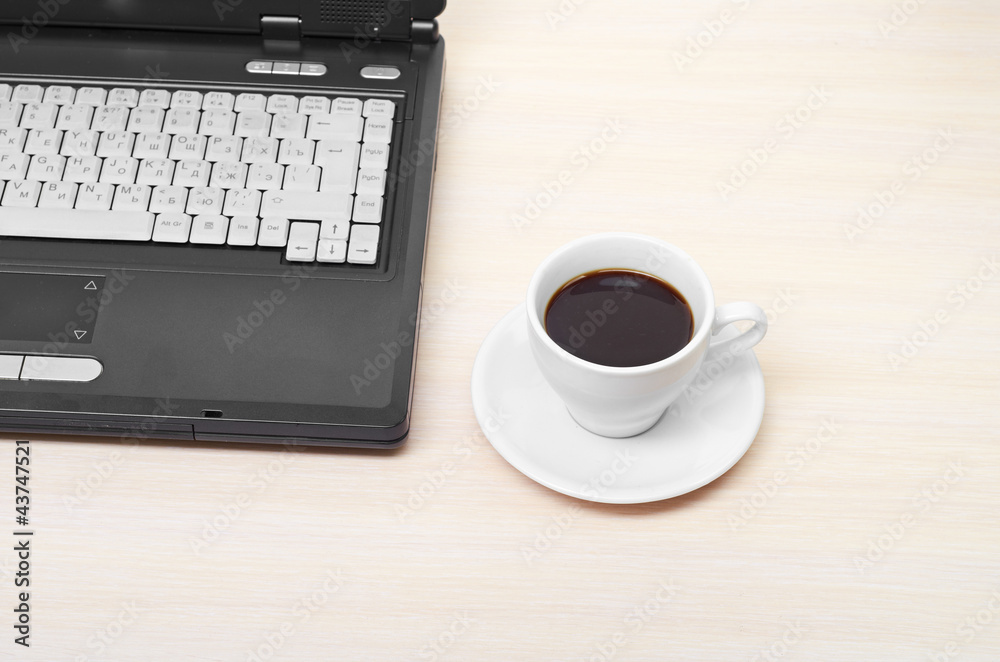laptop with fresh cup of coffee and notebook laptop with fresh cup of coffee and notebook