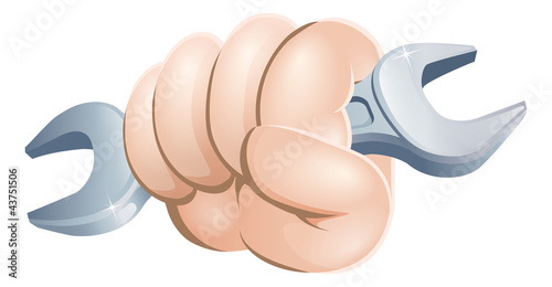 Hand holding spanner