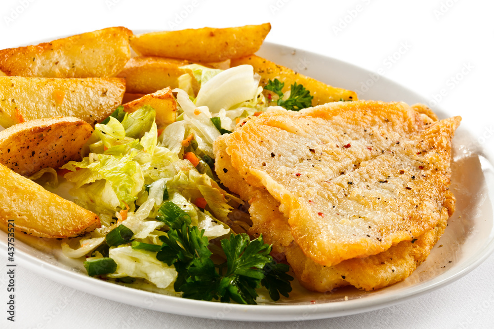 Fish dish - fried fish fillets and vegetables Fish dish - fried fish fillets and vegetables