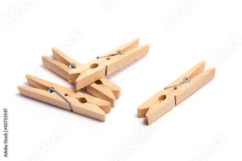 Vászonkép Wooden clothes clips isolated on white.
