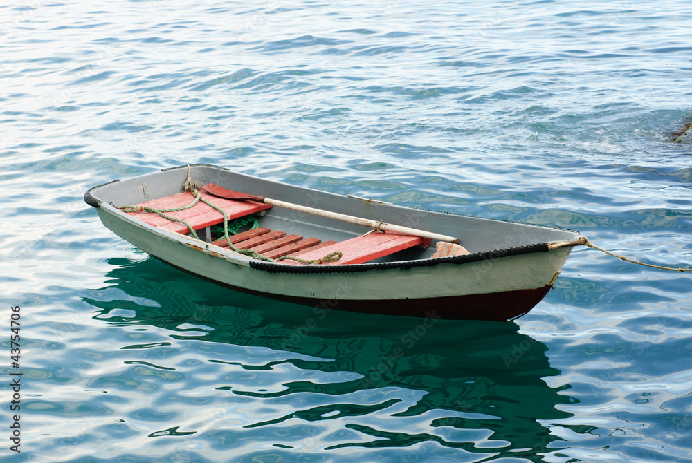 Lifeboat with paddle. Old wooden boat Lifeboat with paddle. Old wooden boat