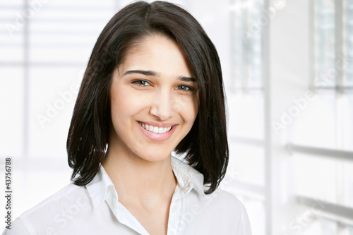 Young business woman in an office Free Download Young business woman in an office - GFXLoad
