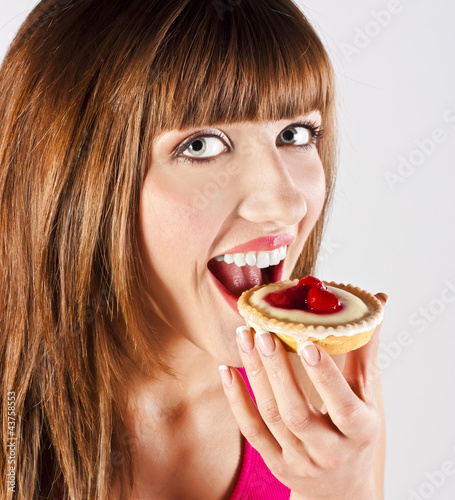 Young beautiful woman with a cake
