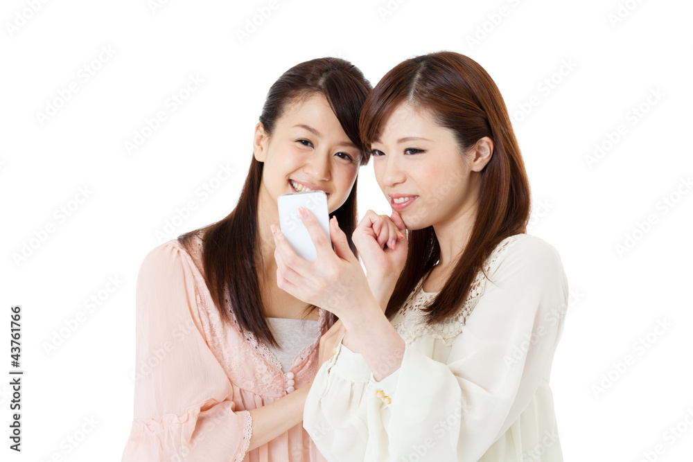 Beautiful young women using a mobile phone. Portrait of asian. Beautiful young women using a mobile phone. Portrait of asian.