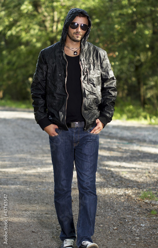 Casual young man walking in nature