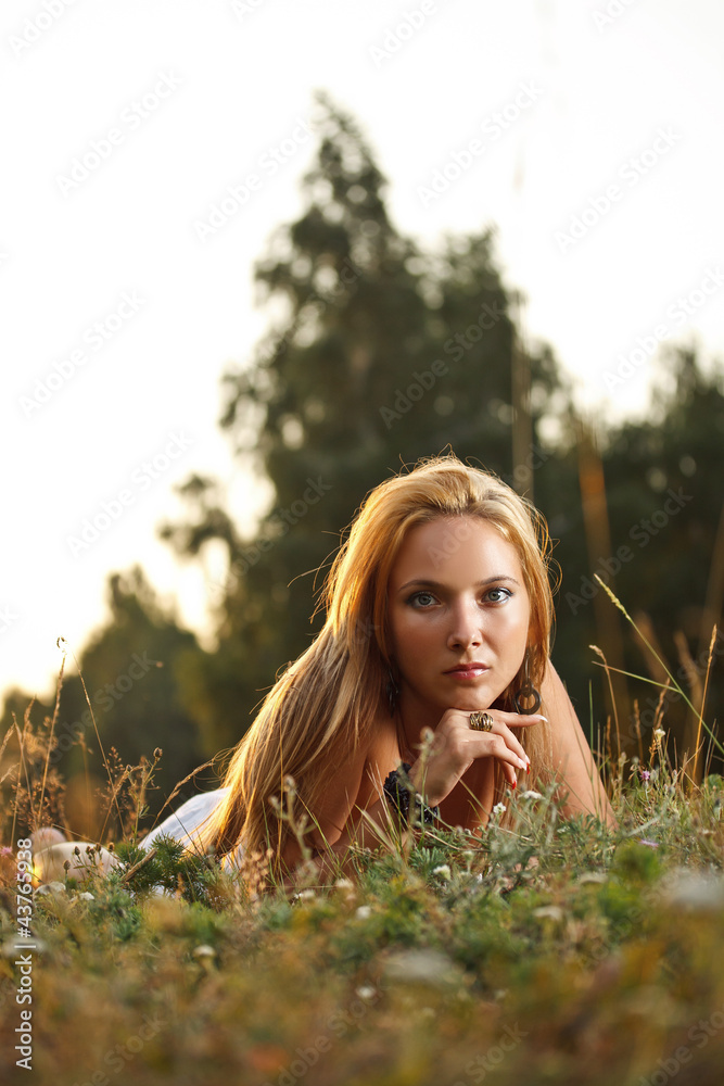Woman laying on a meadow