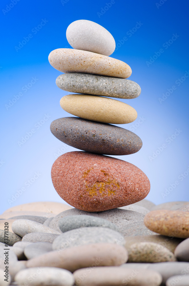 Pebbles stack against gradient background Pebbles stack against gradient background