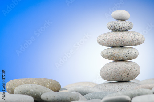 Pebbles stack against gradient background