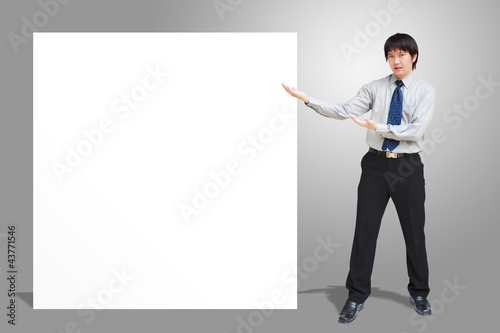 Asian business man showing blank signboard © Patrick Foto