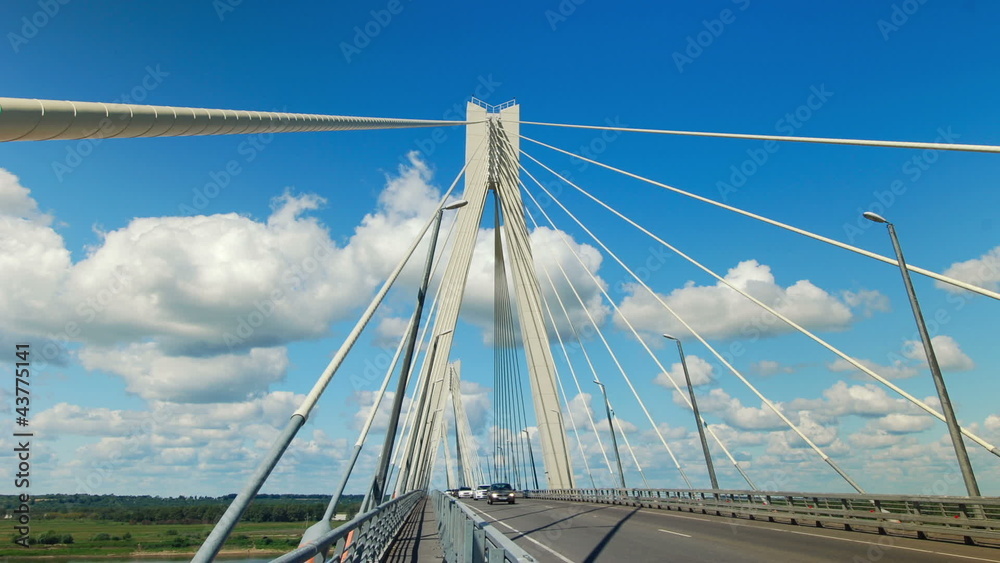 Highway bridge crosses a river, time lapse clip Highway bridge crosses a river, time lapse clip
