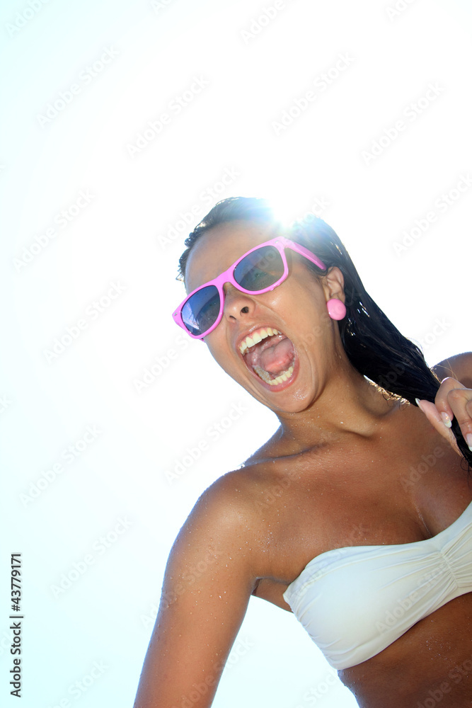Naklejka premium Young woman on the beach