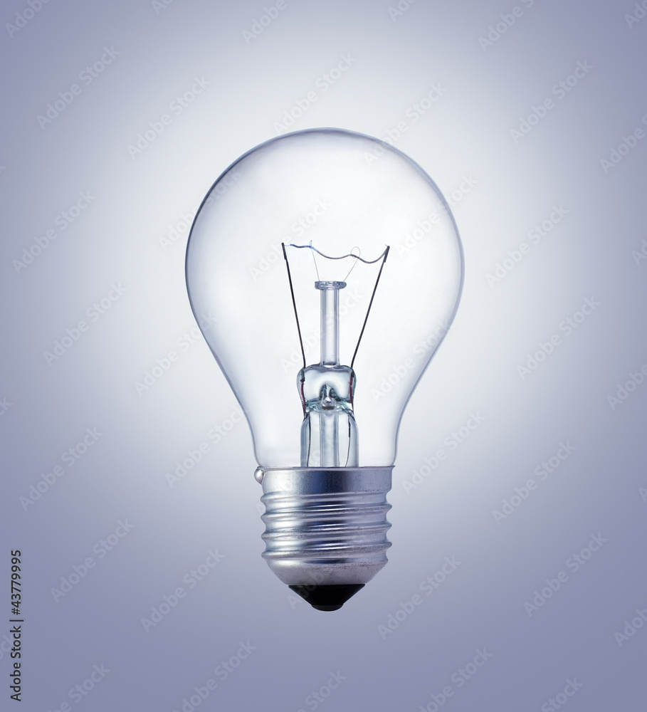Light bulb on the gray surface Light bulb on the gray surface