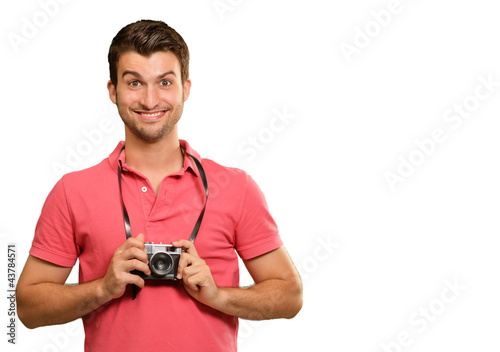 Portrait of a man holding camera
