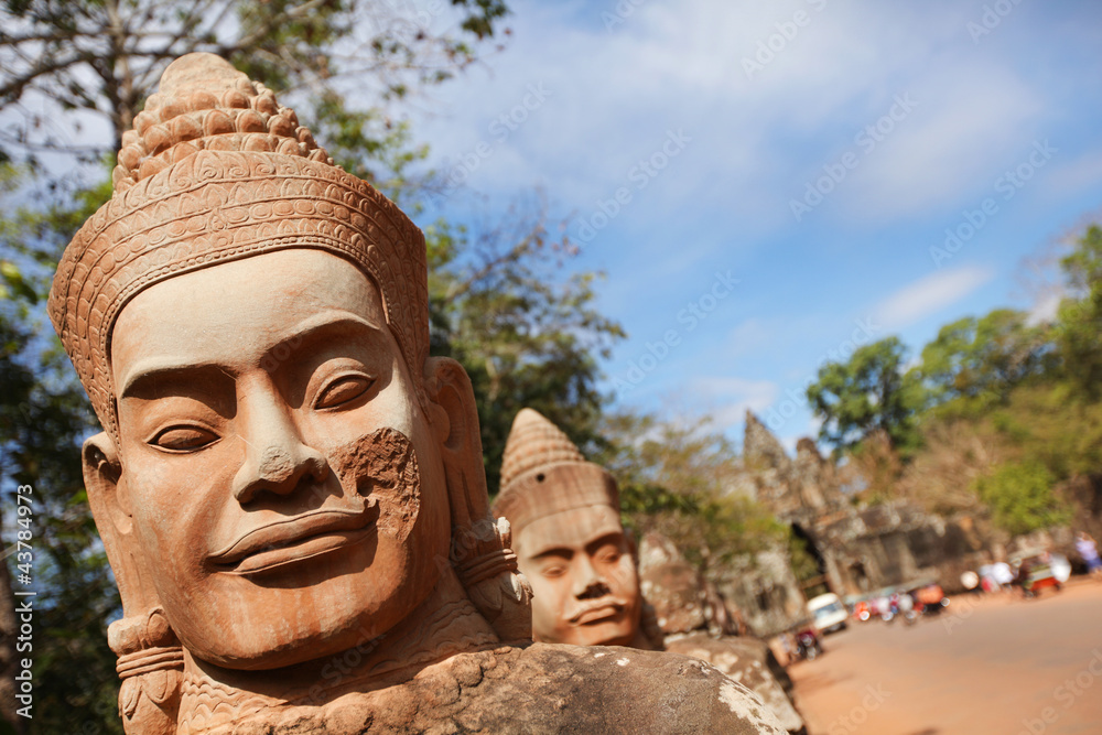Stone face soldiers protecting Bayon temple, Angkor, Cambodia