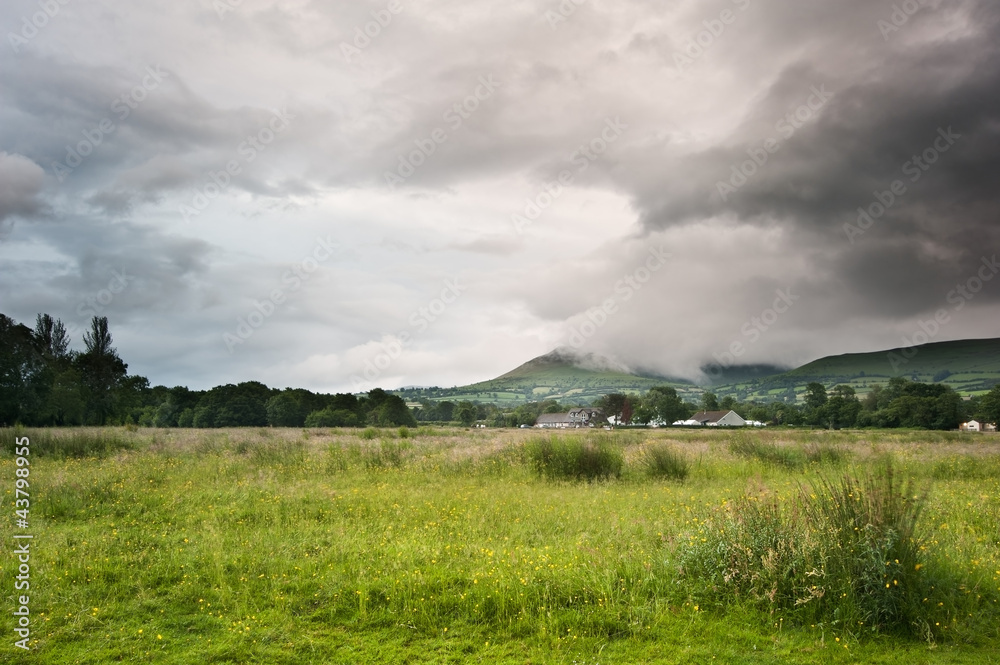 Countryside landscape image across to mountains in distance with