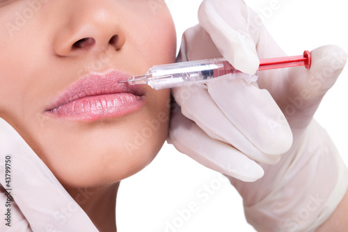Woman receiving injection in her lips