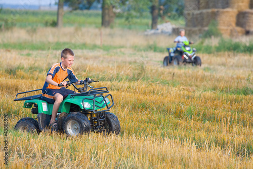 Boy riding a quad bike