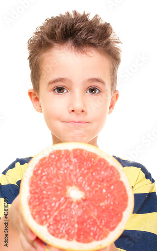 Little boy holding grapefruit photo