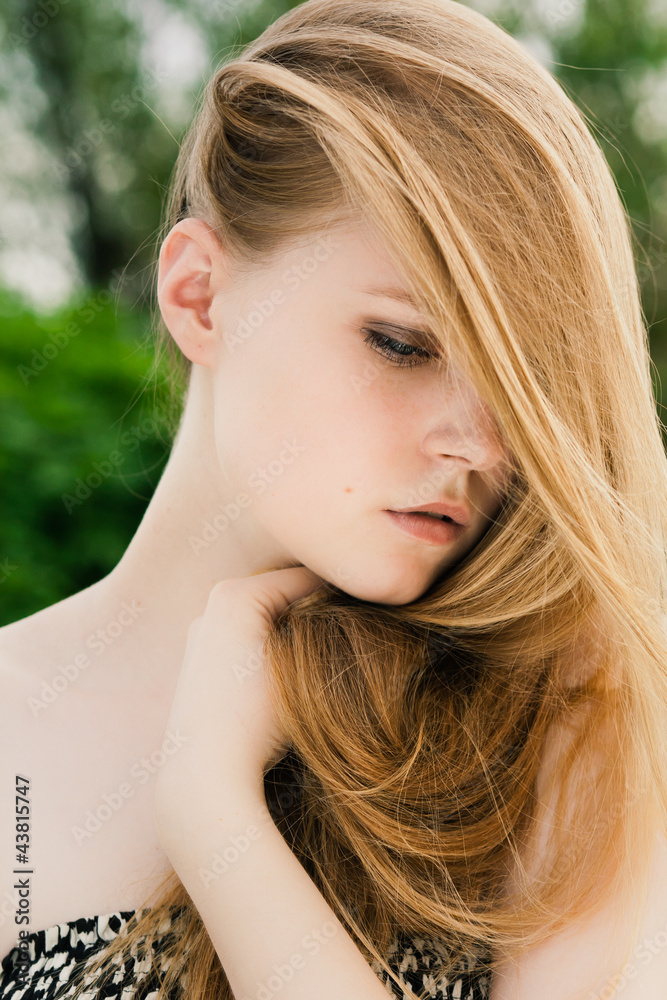 Blond in green grass