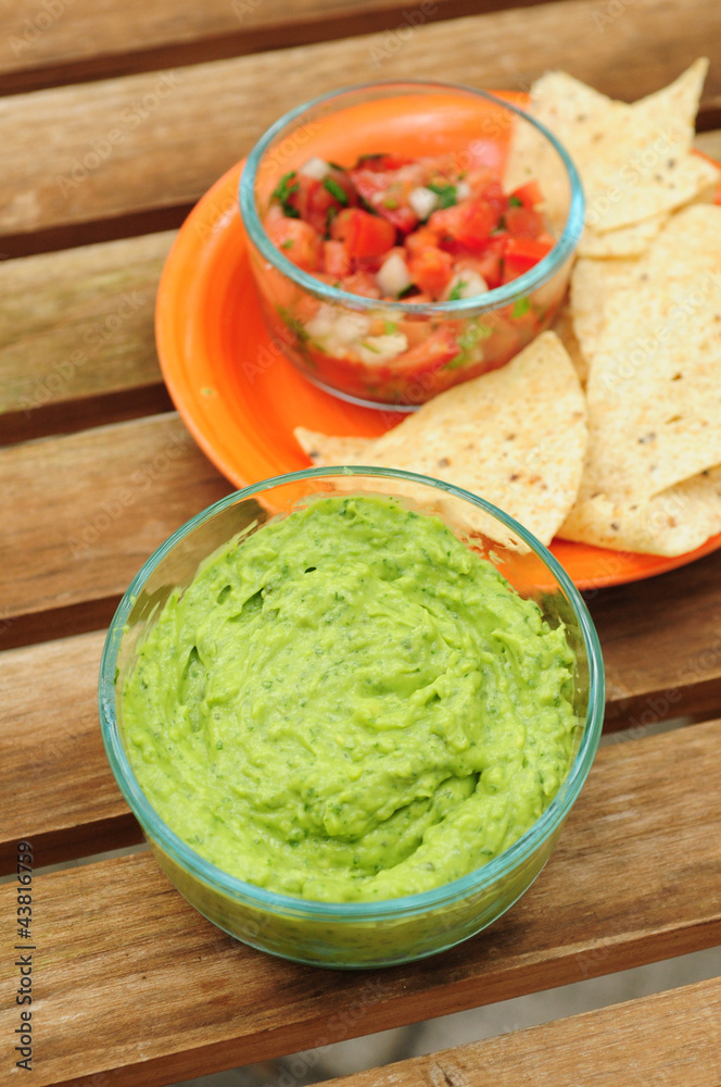 Guacamole dip with chips and salsa Guacamole dip with chips and salsa