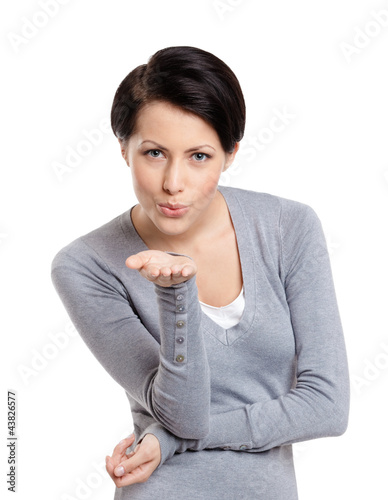 Obraz na płótnie Beautiful lady throws a kiss, isolated on white