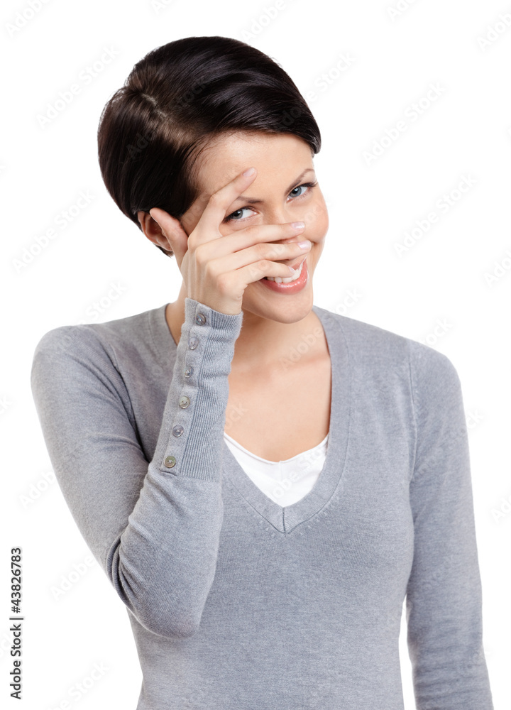 Young woman covers her eyes with hand, isolated on white Young woman covers her eyes with hand, isolated on white