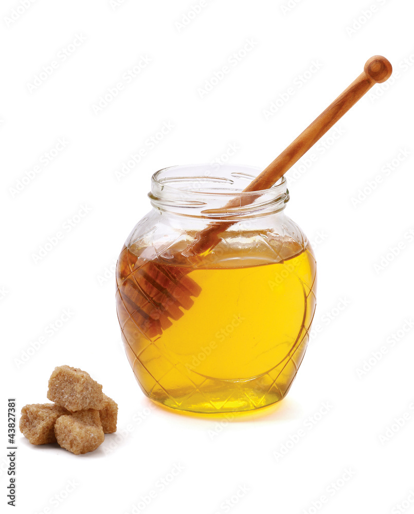 Honey with wood stick, isolated on white background Honey with wood stick, isolated on white background