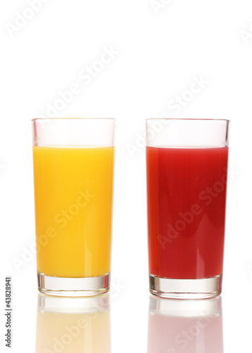 Tropical juices in glasses isolated on white