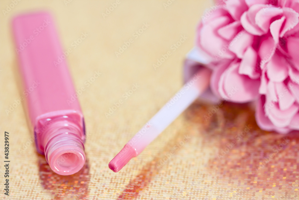pink lipgloss with flower petals pink lipgloss with flower petals