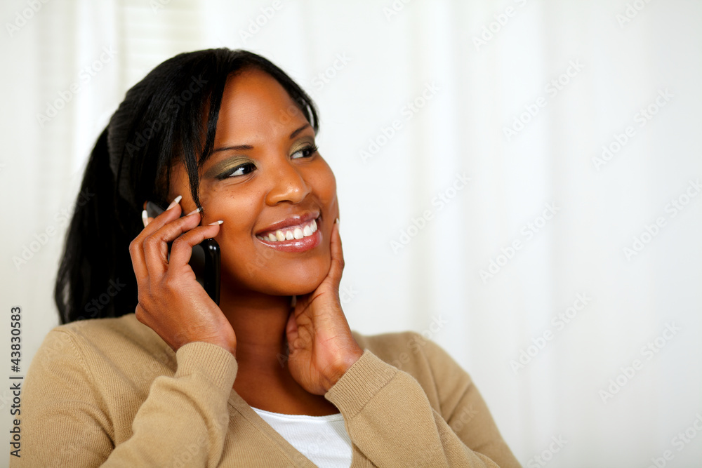 Fresh woman smiling and conversing on mobile Fresh woman smiling and conversing on mobile