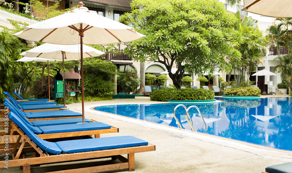 Fototapeta premium Swimming pool with relaxing seats
