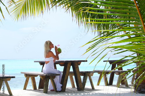 woman in a tropical cafe