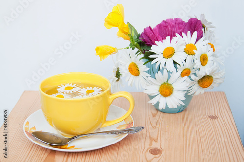Fototapeta Naklejka Na Ścianę i Meble -  Teacup with soothing chamomile tea