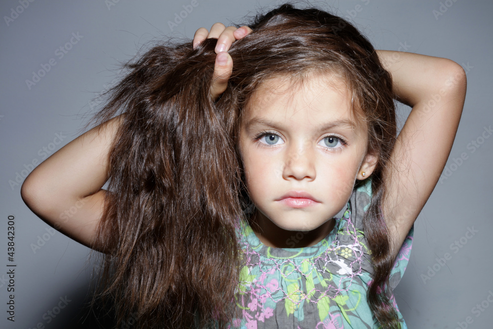 close up portrait of young beautiful little girl with dark hair close up portrait of young beautiful little girl with dark hair