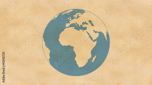 Animation of Planet Earth, made of paper, rotating on a paper.