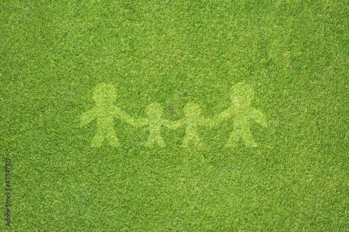 Family on green grass texture and  background