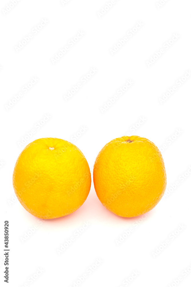 two oranges over white paper two oranges over white paper