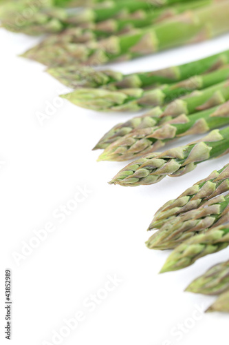 Green asparagus on white background