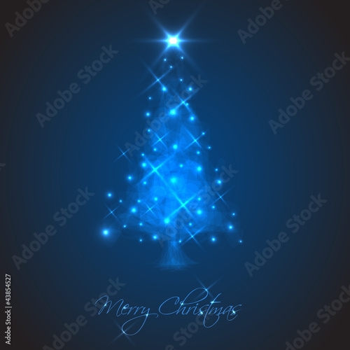 Abstract Christmas tree made of light and sparkles