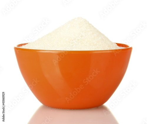 A colorful bowl full of white sugar isolated on white