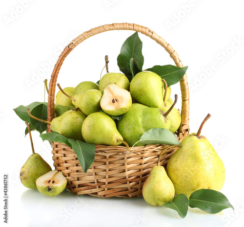 Juicy flavorful pears in basket isolated on white