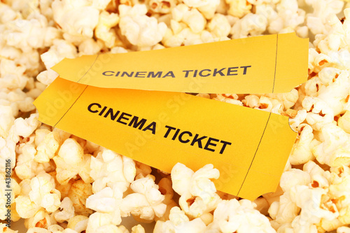 cinema tickets on popcorn background