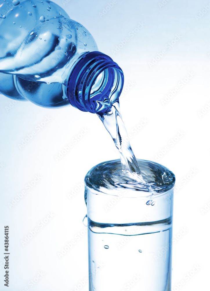 water pouring into glass on white background water pouring into glass on white background