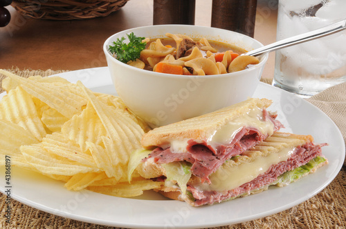 Grilled pastrami sandwich with soup photo