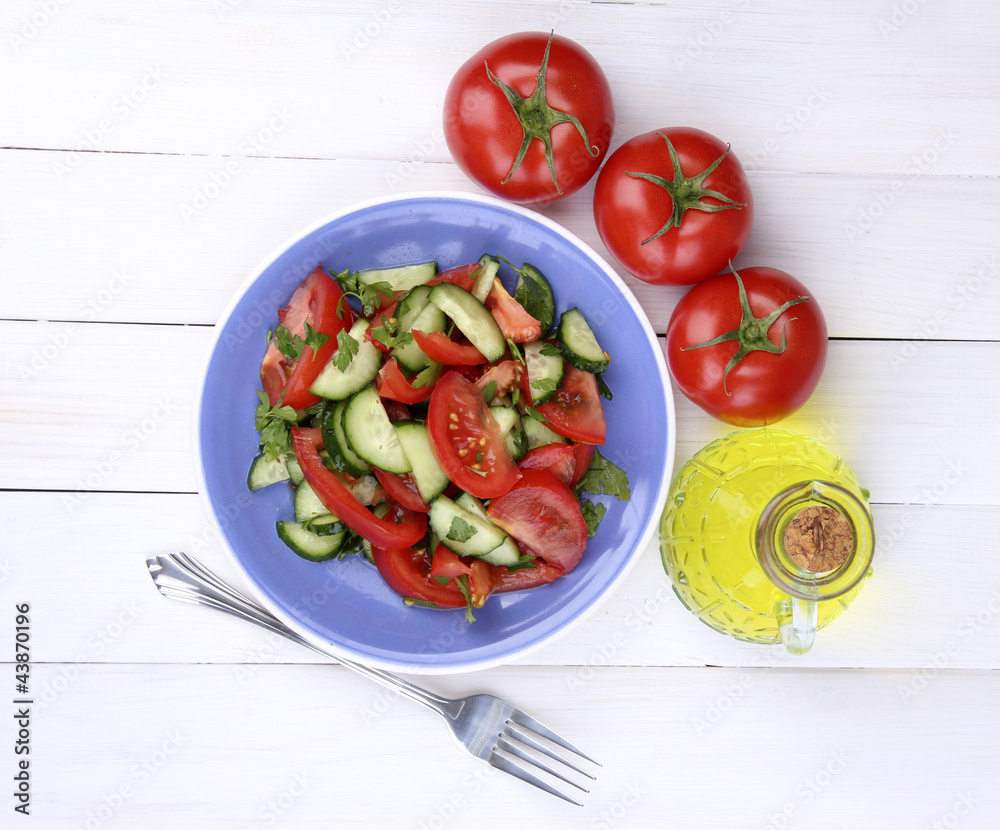 Fresh salad with tomatoes and cucumbers Fresh salad with tomatoes and cucumbers